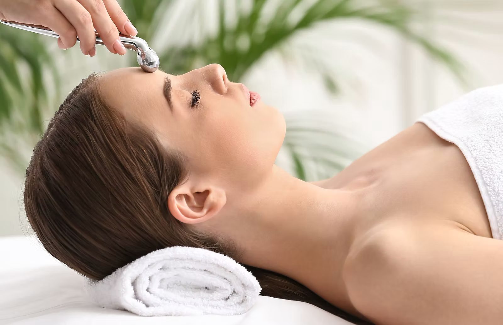 A client having a facial treatment in the NuGlow treatment room.